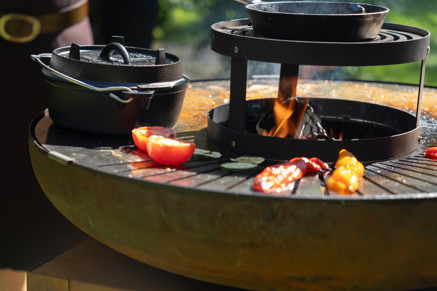 circular wood fired BBQ plancha grill Bakka